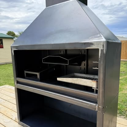Close view of a custom outdoor fireplace firebox