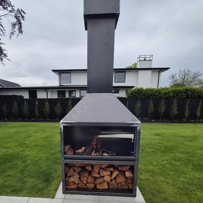 Outdoor fireplace with integrated wood storage